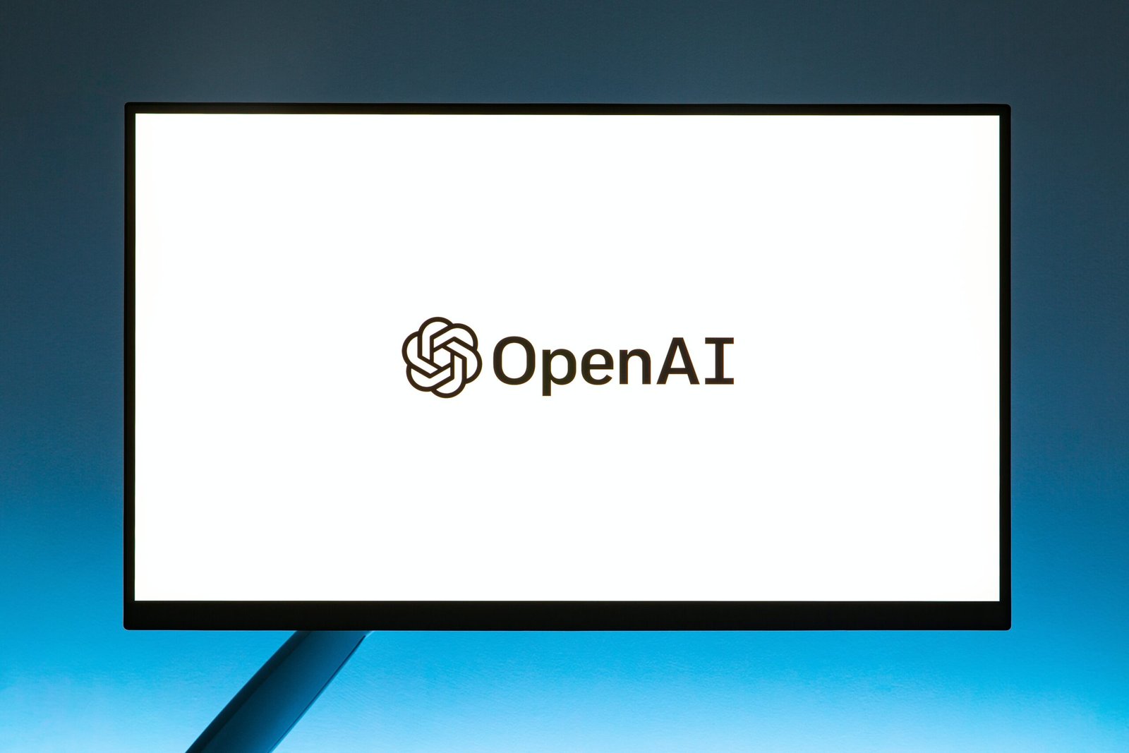 a computer screen with the open ai logo on it